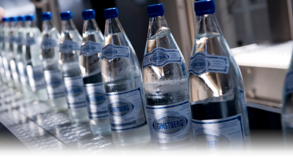 Christeyns a fourni, entre autres, la lubrification des pistes pour faire circuler les bouteilles de façon fluide